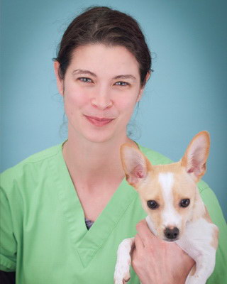 Crystal, Certified Veterinary Technician, with her dog Spike